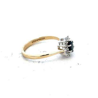 9ct yellow gold sapphire and diamond ring in size L with a detailed band design, unbranded jewelry piece.