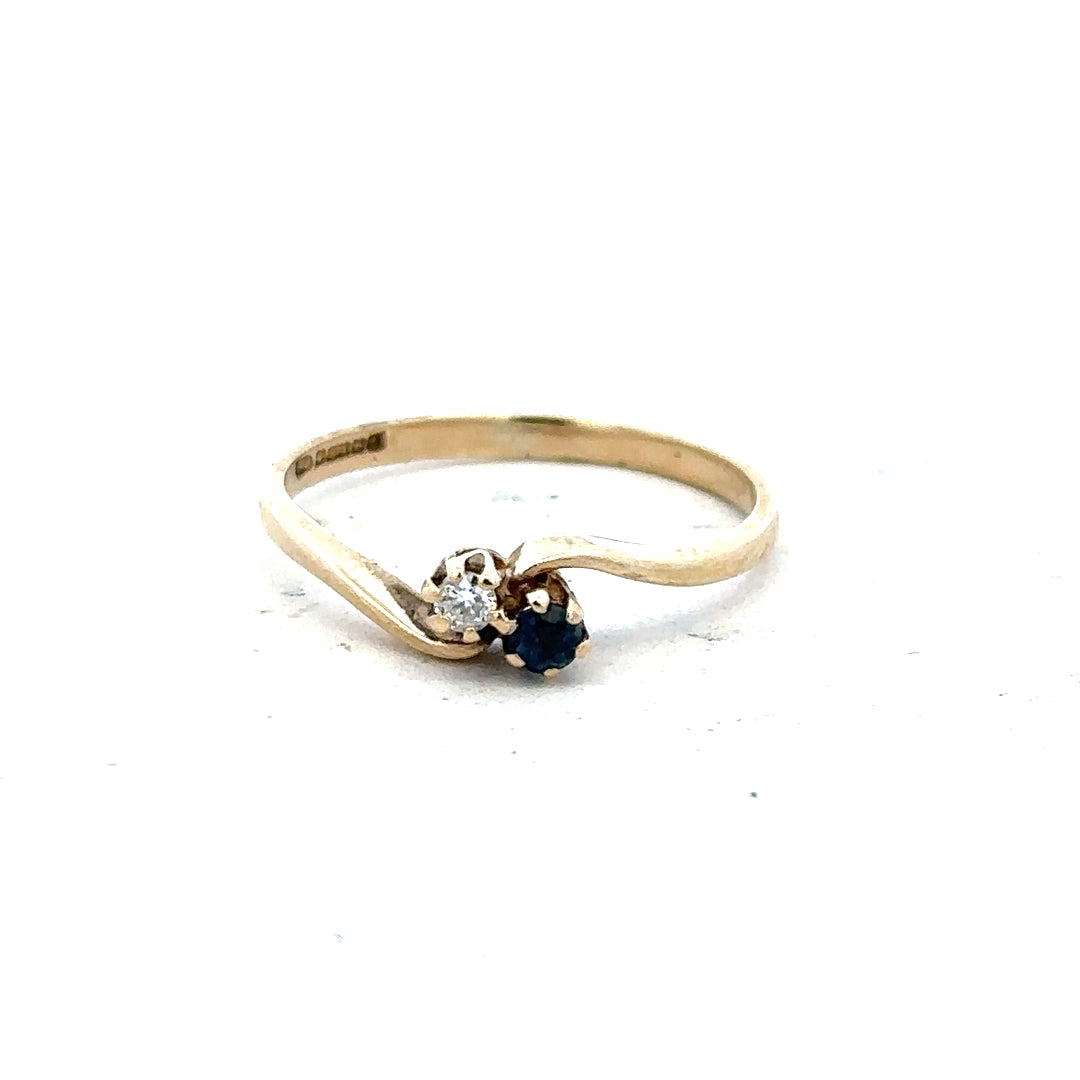 9ct yellow gold sapphire and diamond ring, size M, featuring a central sapphire with diamond accents, unbranded jewelry.