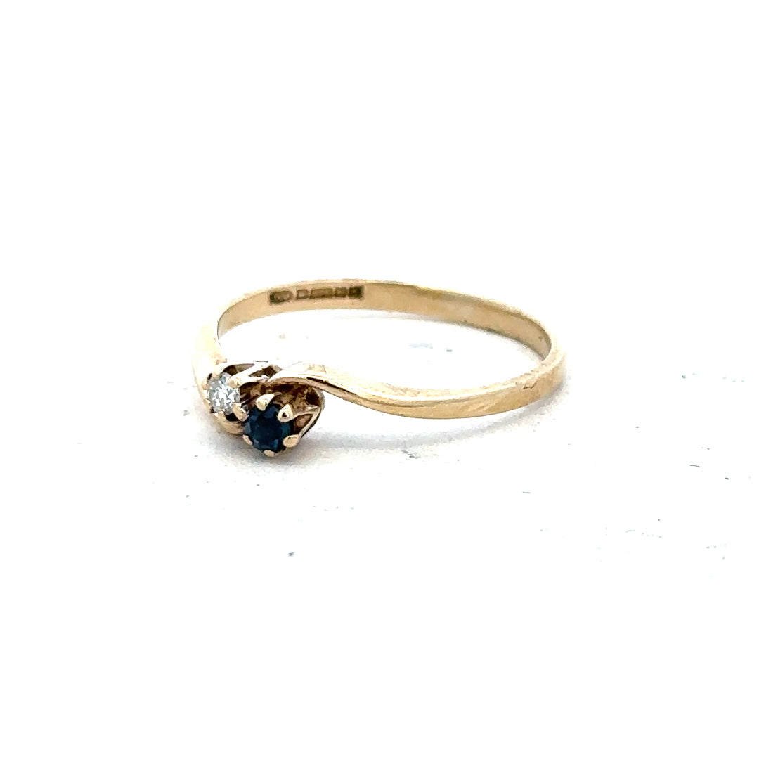 9ct yellow gold sapphire and diamond ring in size M, featuring a detailed band with sparkling gemstones.