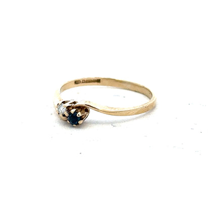 9ct yellow gold sapphire and diamond ring in size M, featuring a detailed band with sparkling gemstones.