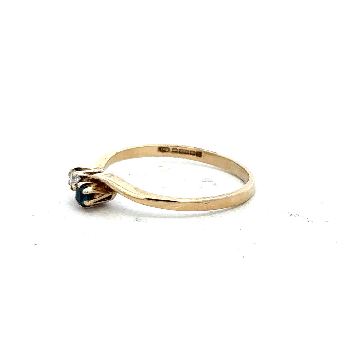 9ct yellow gold sapphire and diamond ring, size M, featuring a central sapphire and sparkling diamonds on an elegant band.