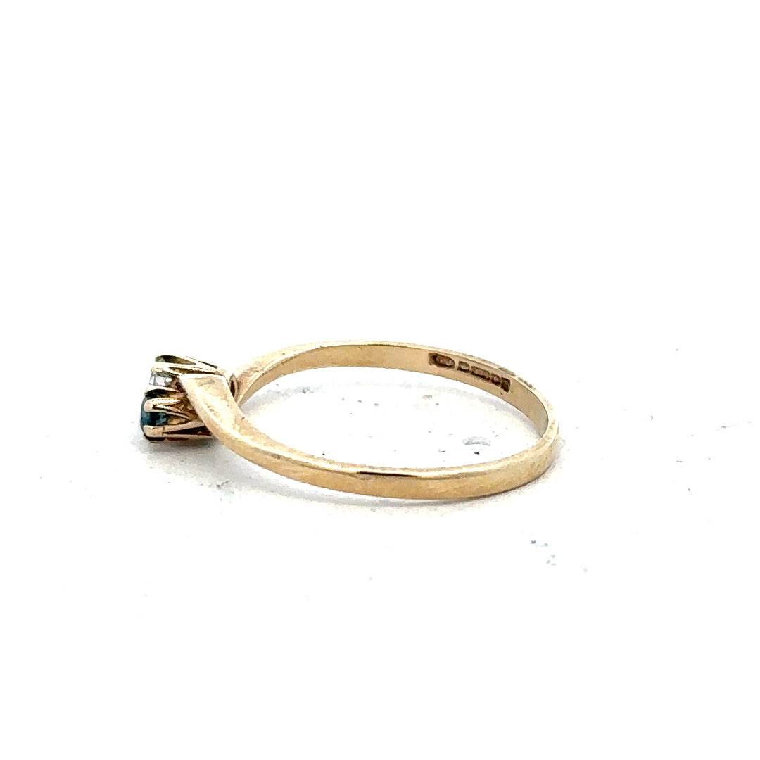 9ct yellow gold sapphire and diamond ring, size M, featuring a central sapphire with diamond accents, unbranded jewelry piece.