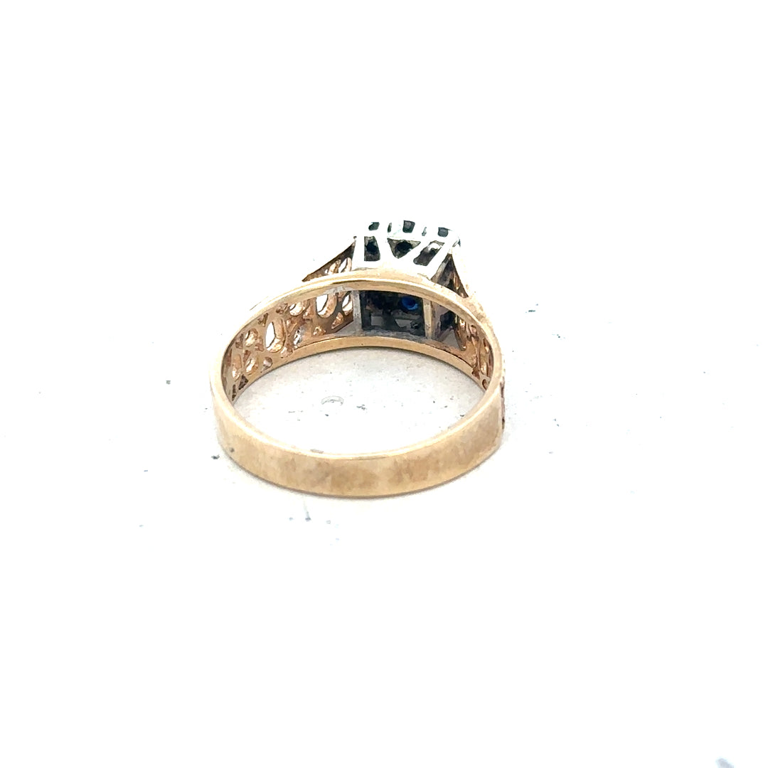 9ct yellow gold sapphire and diamond ring, size N1/2, featuring a central sapphire with diamond accents on a sleek band.