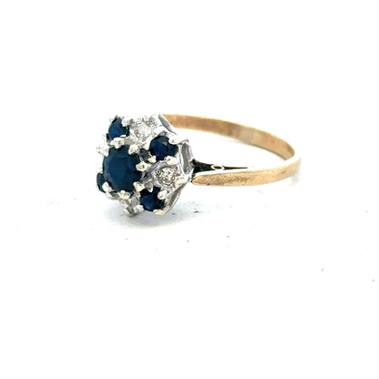 9ct yellow gold sapphire and diamond ring, size P, showcasing a central sapphire with diamond accents on a gold band.
