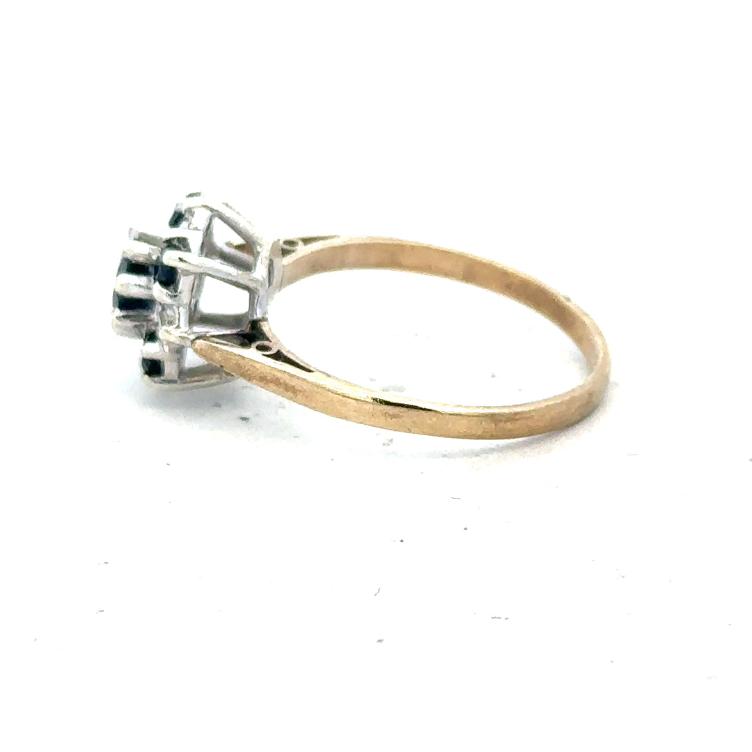 9ct yellow gold sapphire and diamond ring in size P, featuring a central sapphire gemstone with diamond accents.