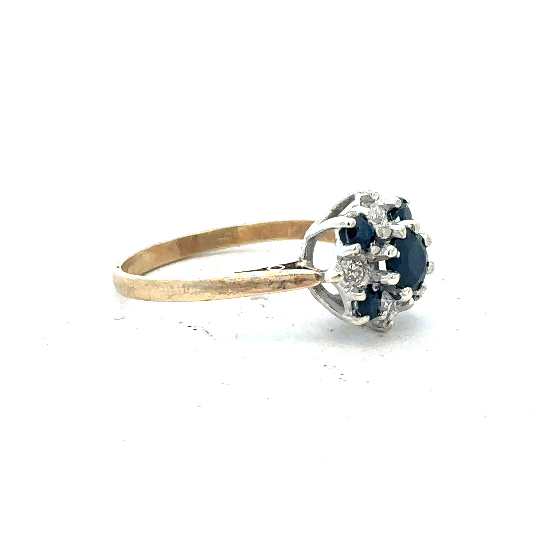 9ct yellow gold sapphire and diamond ring, size P, featuring a central sapphire gemstone and sparkling diamonds.