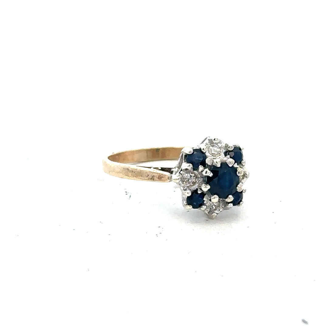 9ct yellow gold sapphire and diamond ring, size P, featuring a vibrant sapphire centerpiece with sparkling diamonds.