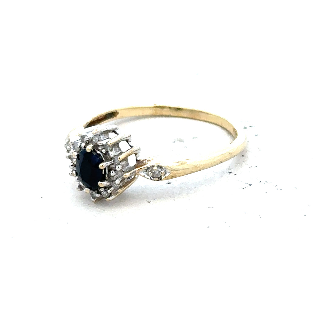 9ct yellow gold sapphire and diamond ring in size P, featuring a vibrant sapphire center with sparkling diamonds.