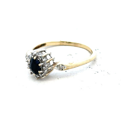 9ct yellow gold sapphire and diamond ring in size P, featuring a vibrant sapphire center with sparkling diamonds.