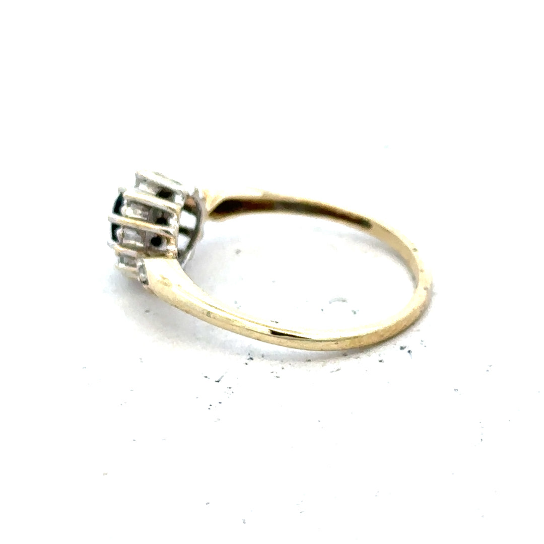 9ct yellow gold sapphire and diamond ring in size P, featuring a central sapphire with diamond accents, unbranded jewelry.