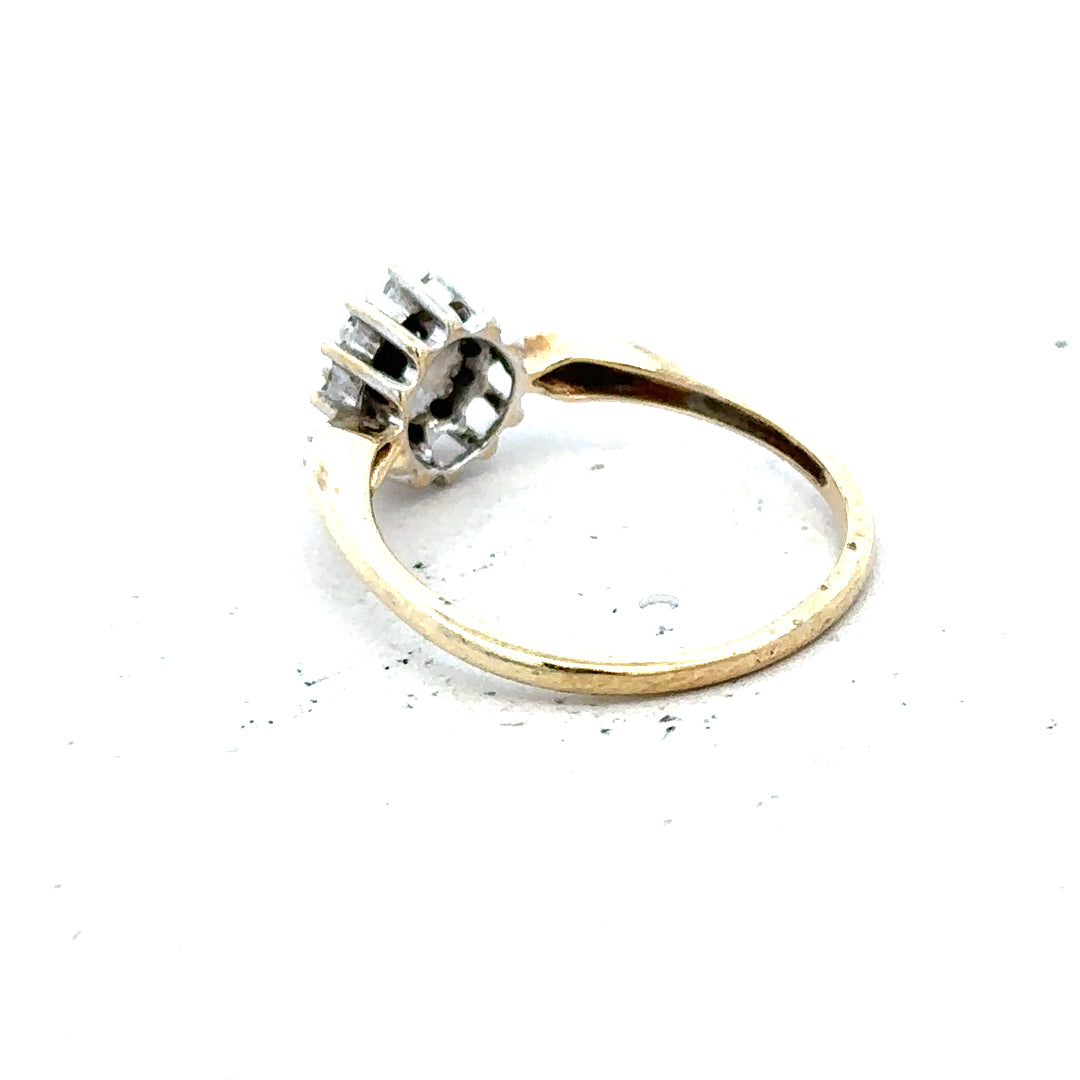 9ct yellow gold sapphire and diamond ring in size P, featuring a central sapphire with diamond accents, unbranded jewelry piece.
