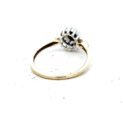 9ct yellow gold sapphire and diamond ring, size P, featuring a central sapphire surrounded by diamonds.