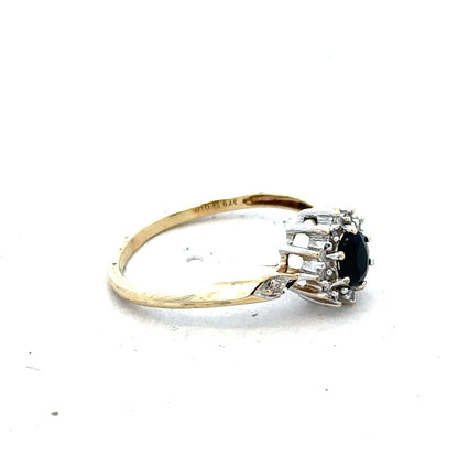 9ct yellow gold sapphire and diamond ring in size P, featuring a central sapphire with diamond accents in a elegant design.