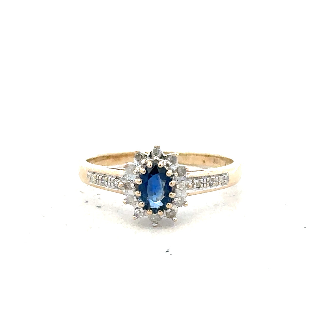 9ct yellow gold sapphire and diamond ring in size P1/2, featuring a gold band with sparkling gemstones.