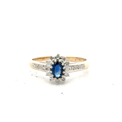 9ct yellow gold sapphire and diamond ring in size P1/2, featuring a gold band with sparkling gemstones.
