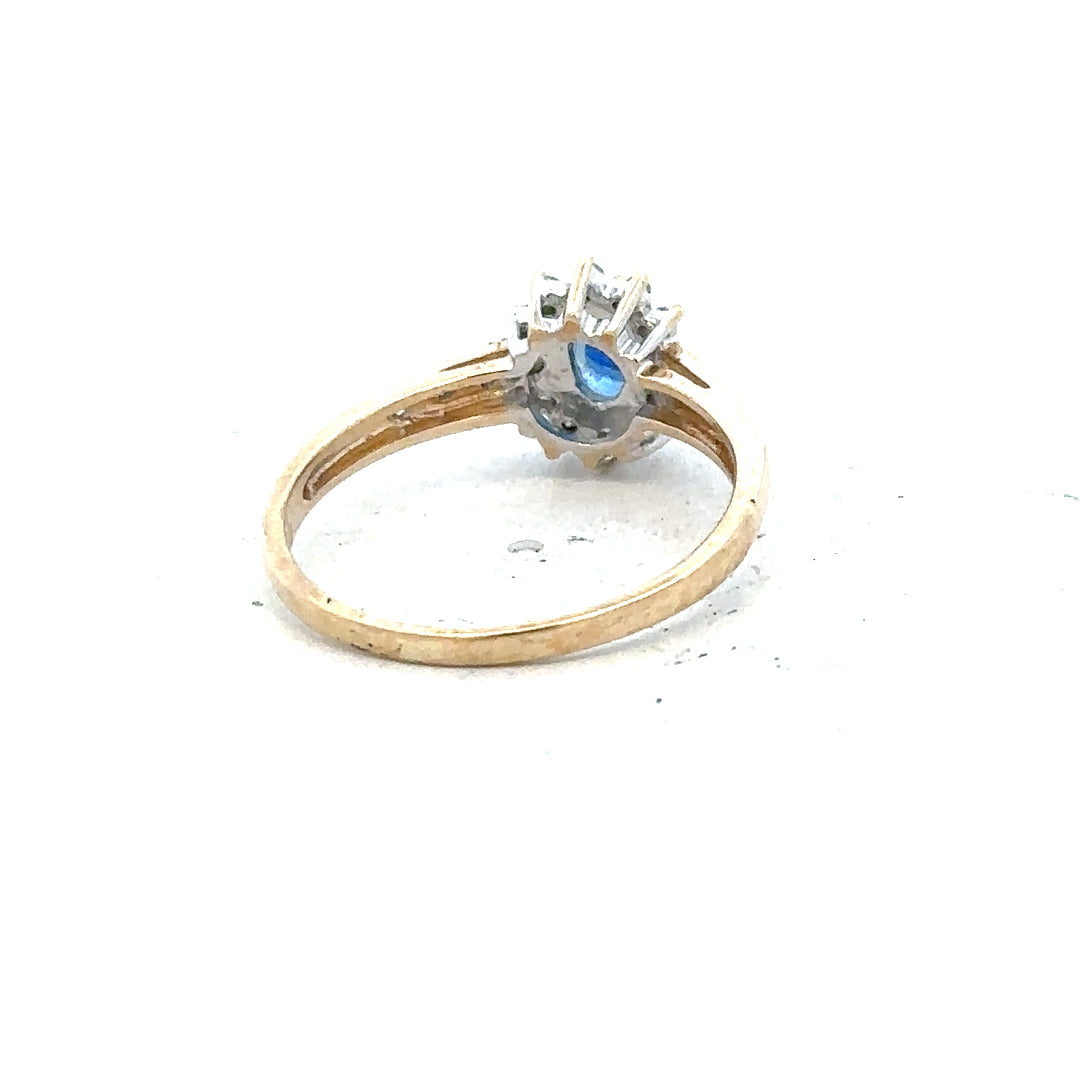 9ct yellow gold sapphire and diamond ring in size P1/2, featuring a central sapphire with sparkling diamonds.