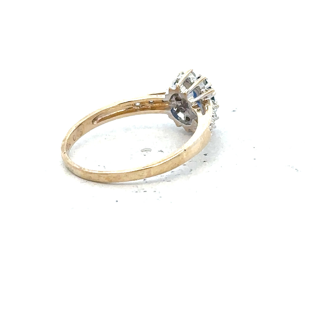 9ct yellow gold sapphire and diamond ring, size P 1/2, featuring a detailed close-up of the elegant jewelry design.