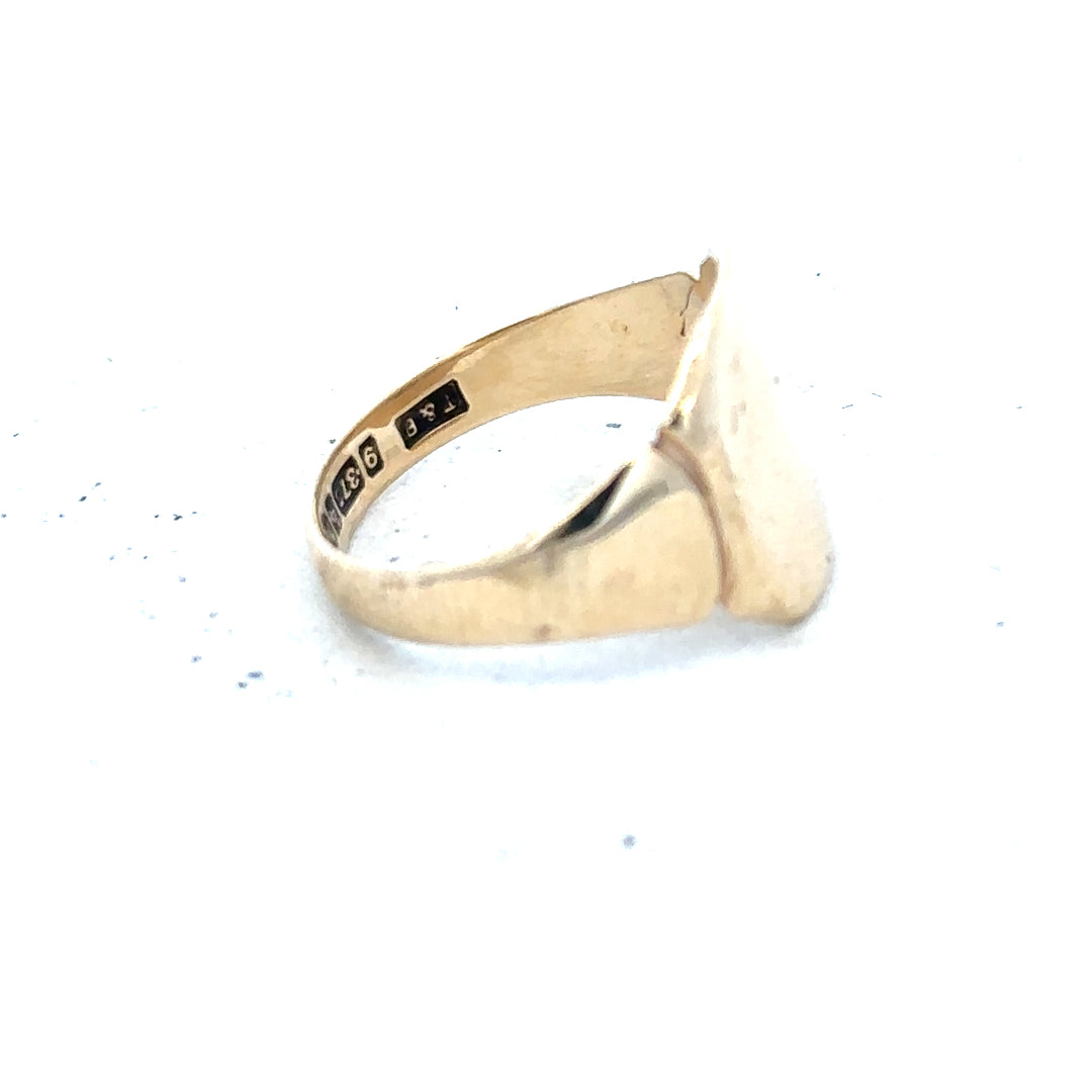9ct yellow gold signet ring in size J, unbranded, with a polished smooth surface and classic design.