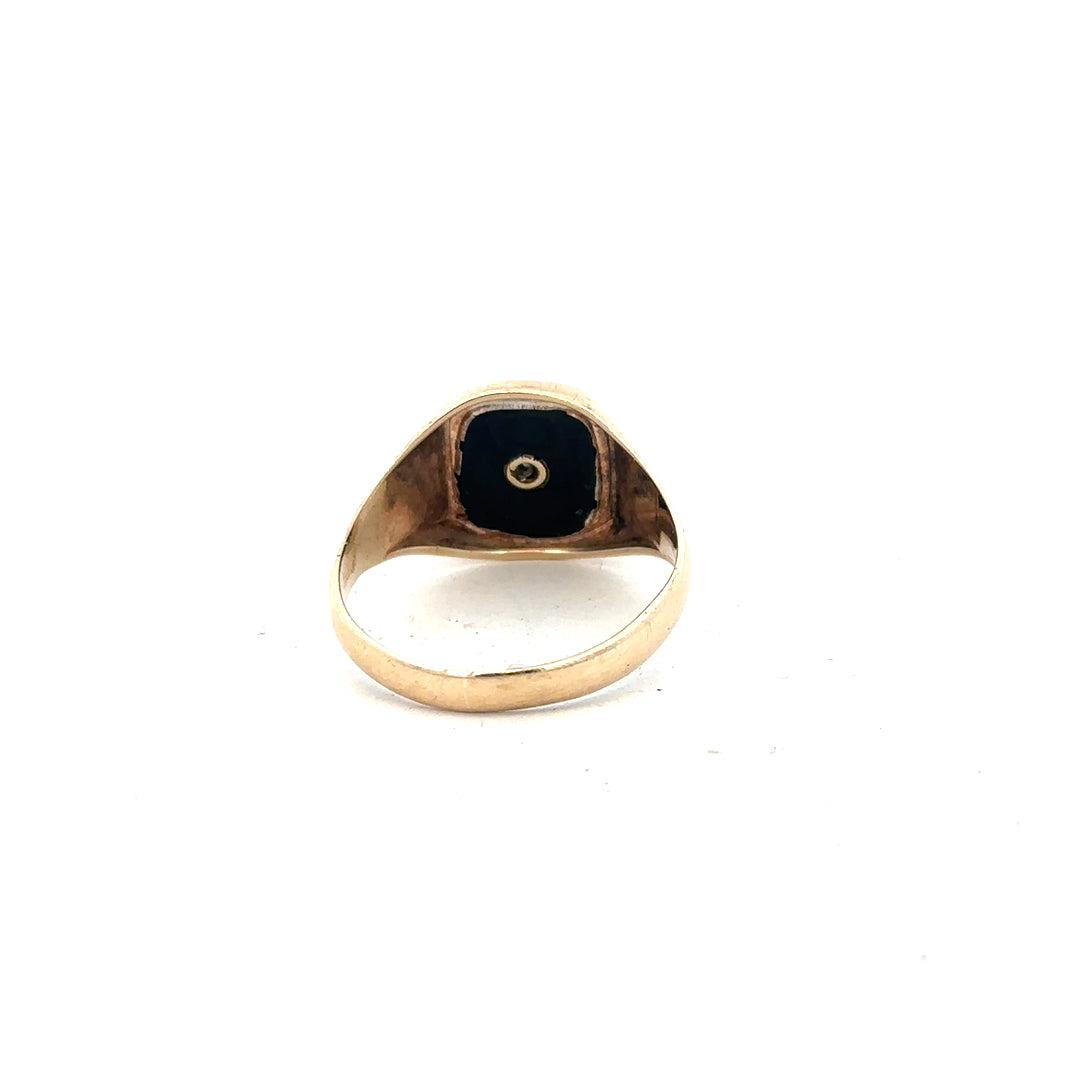 9ct yellow gold signet ring in size X with a smooth polished surface, unbranded jewelry, close-up view.