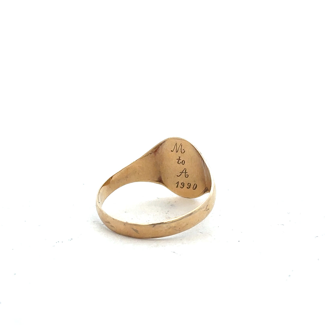 9ct yellow gold signet ring in size Y, unbranded, with smooth polished surface and classic design.