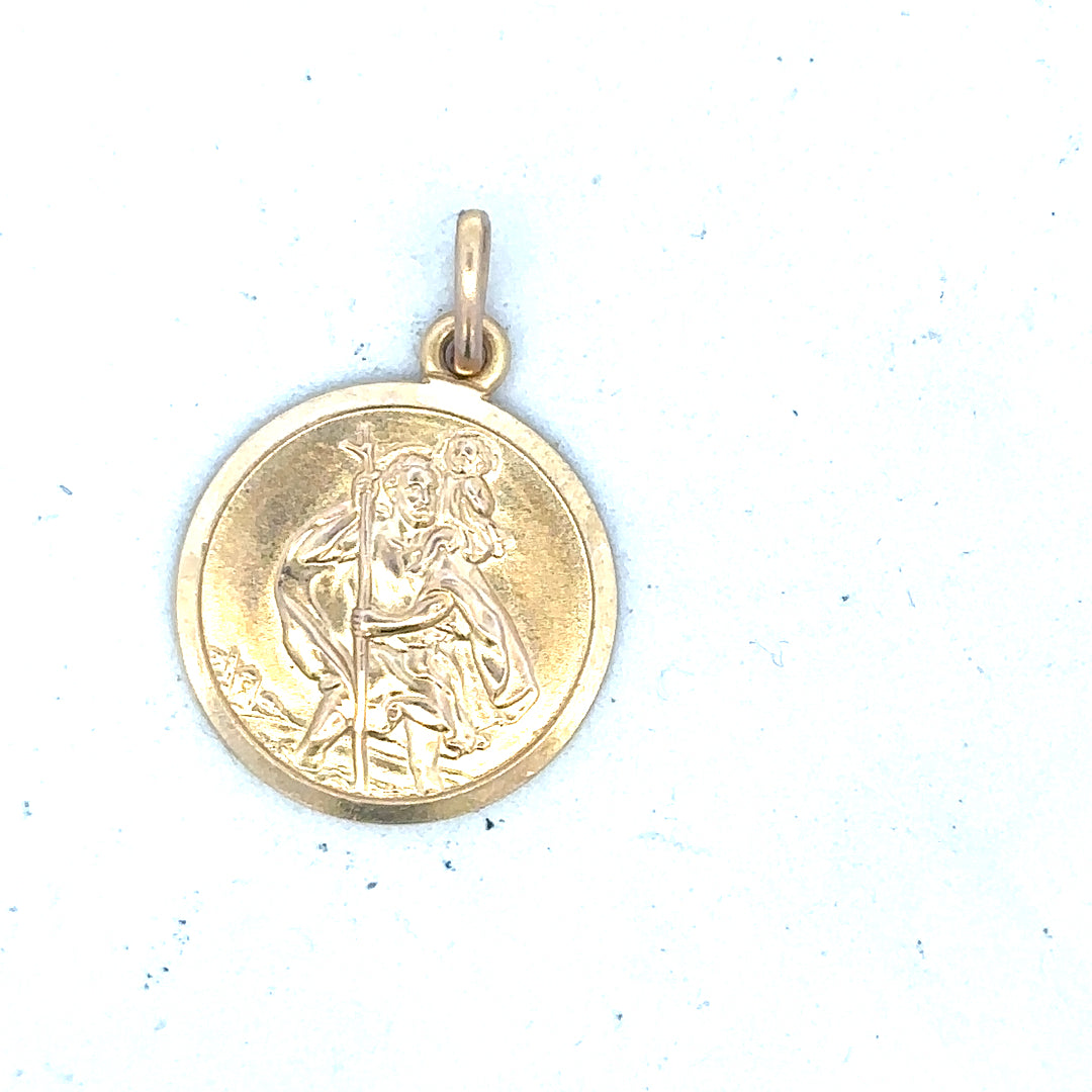 9ct yellow gold St Christopher pendant, unbranded, weighs 3.1g, featuring religious design visible on the pendant.