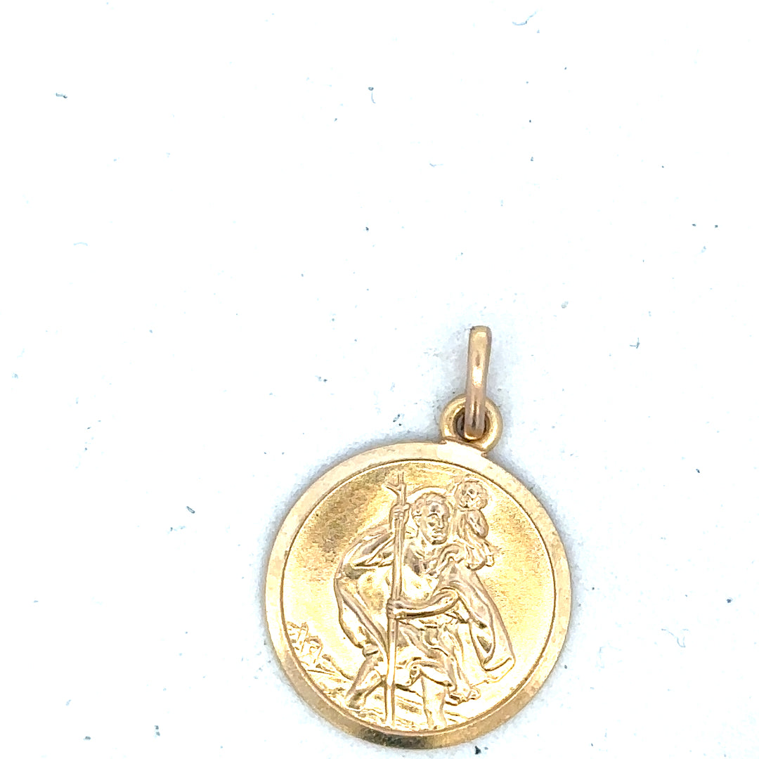 9ct yellow gold St Christopher pendant, unbranded, weighing 3.1g, featuring detailed religious medal design.