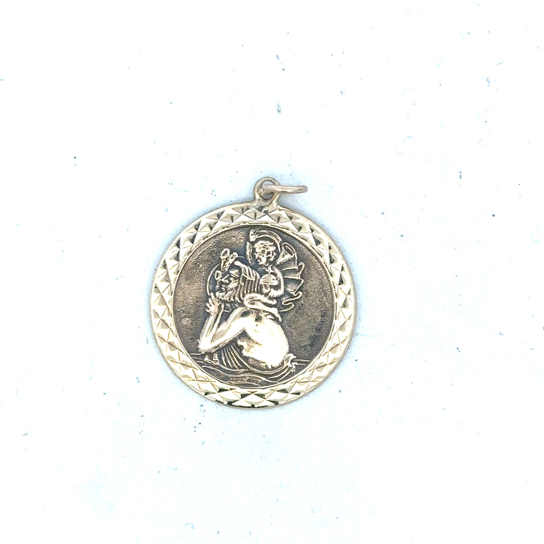 9ct yellow gold St Christopher pendant, unbranded, weighing 4.9g, detailed religious jewelry pendant displayed on a neutral background.