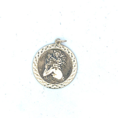 9ct yellow gold St Christopher pendant, unbranded, weighing 4.9g, detailed religious jewelry pendant displayed on a neutral background.