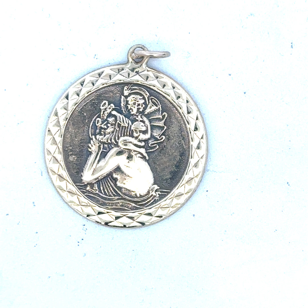 9ct yellow gold St Christopher pendant with detailed religious medal design, weighs approximately 4.9 grams.