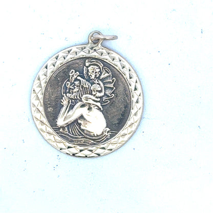 9ct yellow gold St Christopher pendant with detailed religious medal design, weighs approximately 4.9 grams.