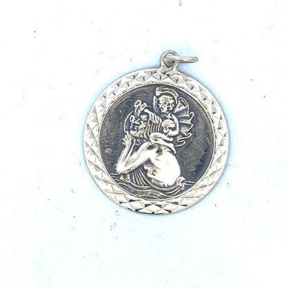 9ct yellow gold St Christopher pendant, unbranded, weighing 4.9g with detailed religious design.