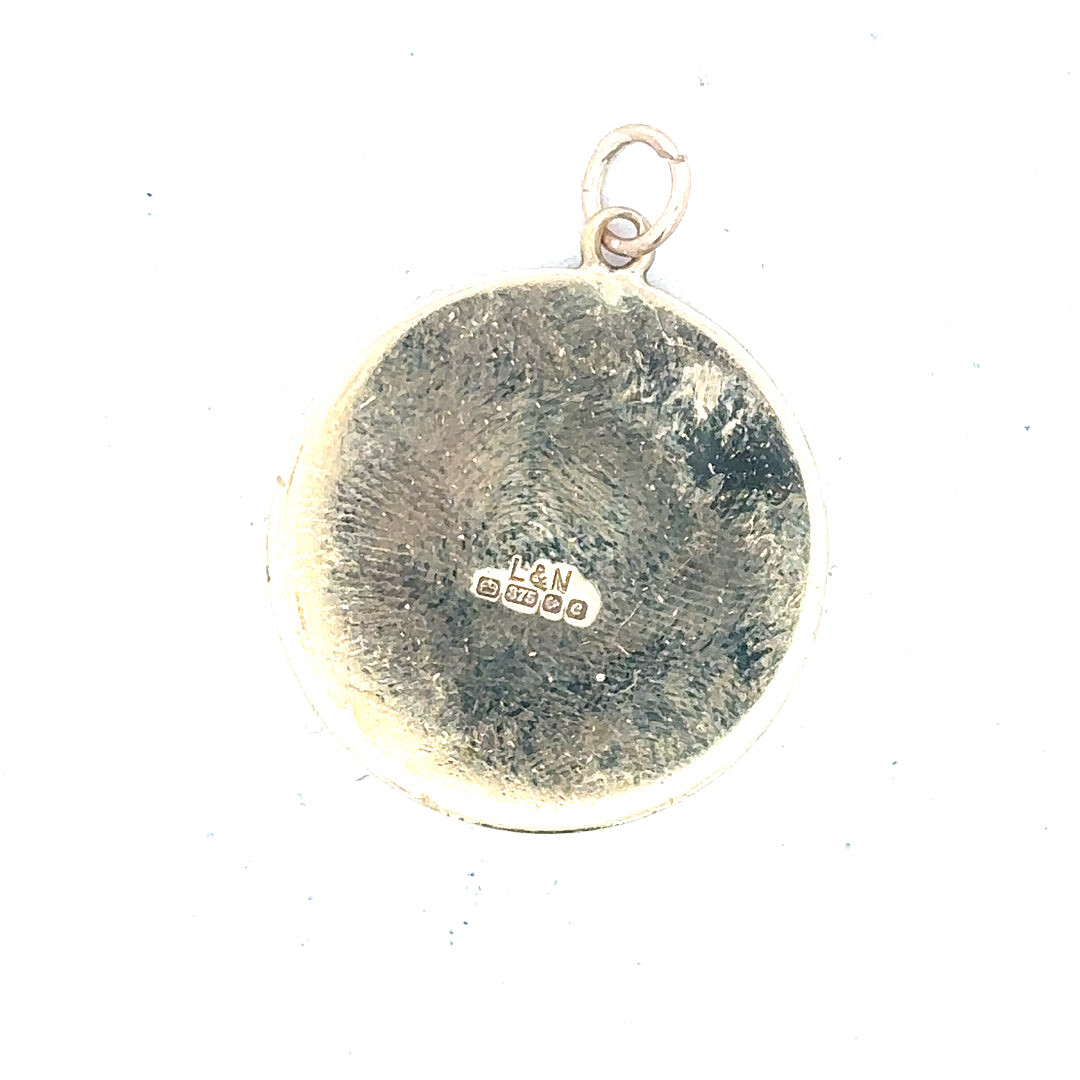 9ct yellow gold St Christopher pendant, unbranded, weighing 4.9g, detailed religious pendant with intricate design visible.