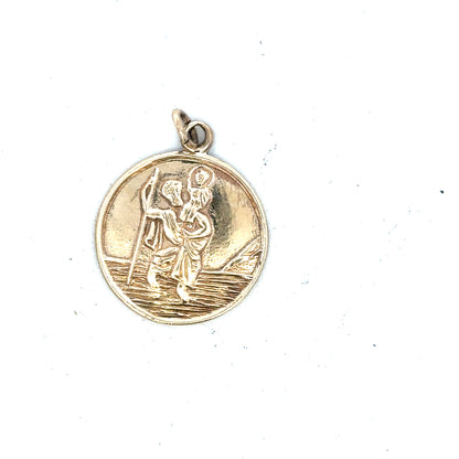 9ct yellow gold St. Christopher pendant, unbranded, weighing 5.7g, featuring detailed religious pendant design.
