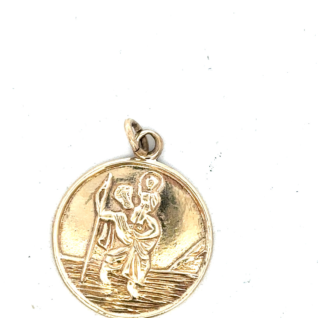 9ct yellow gold St. Christopher pendant with detailed religious design, weighs 5.7g, unbranded jewelry accessory.