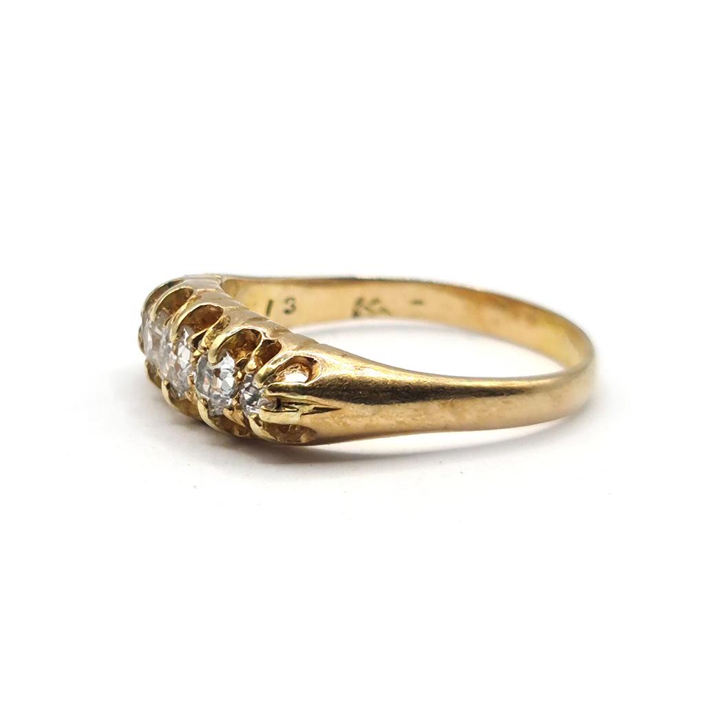 Antique 18ct yellow gold ring with five old cut diamonds totaling 0.57 carats, showcasing vintage elegance and craftsmanship.