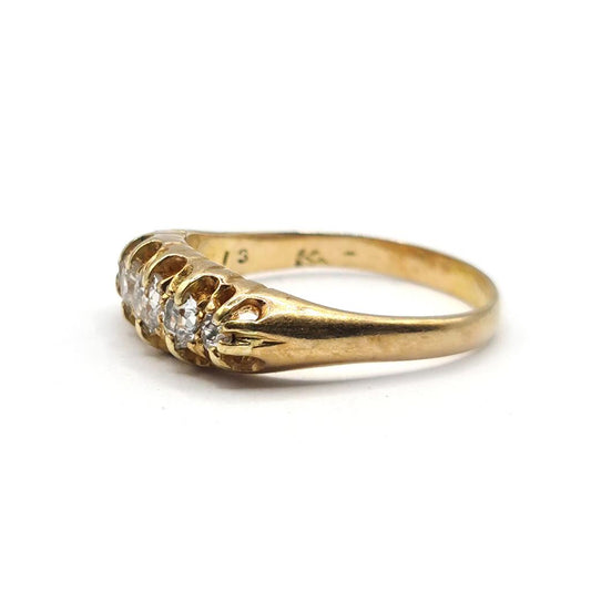 Antique 18ct yellow gold ring with five old cut diamonds totaling 0.57 carats, showcasing vintage elegance and craftsmanship.