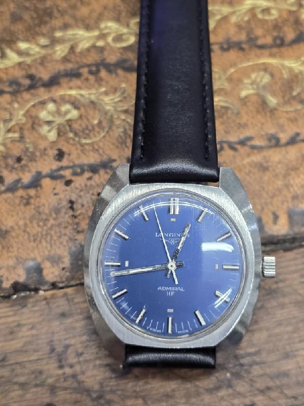 Longines 1972 Munich Olympics watch with a metallic case and detailed dial, showcasing vintage Olympic sports event design.