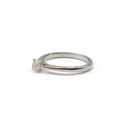 Platinum 0.26 carat diamond solitaire ring with a sleek band and a sparkling center diamond.