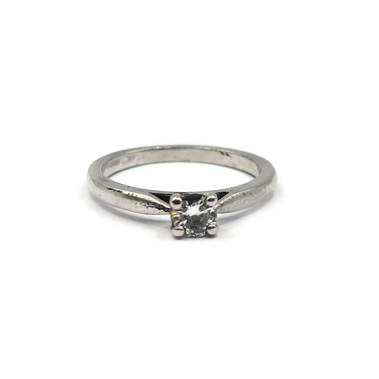 Platinum solitaire ring with a 0.30 carat brilliant cut diamond, showcasing a sleek and elegant design.