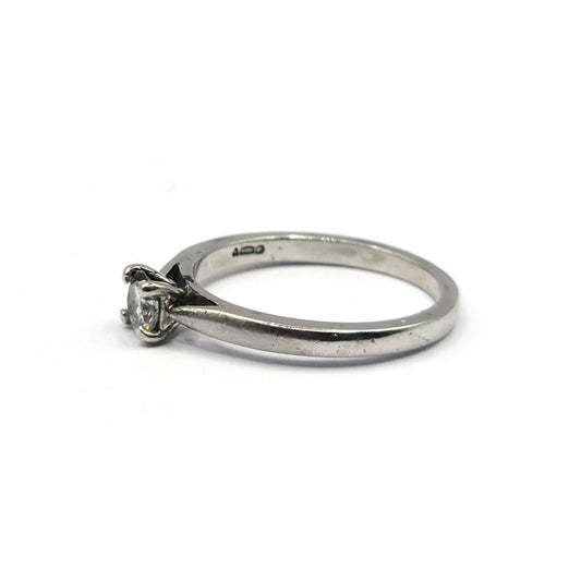 Platinum solitaire diamond ring with a 0.30 carat brilliant-cut diamond, showcasing a sleek and elegant design.