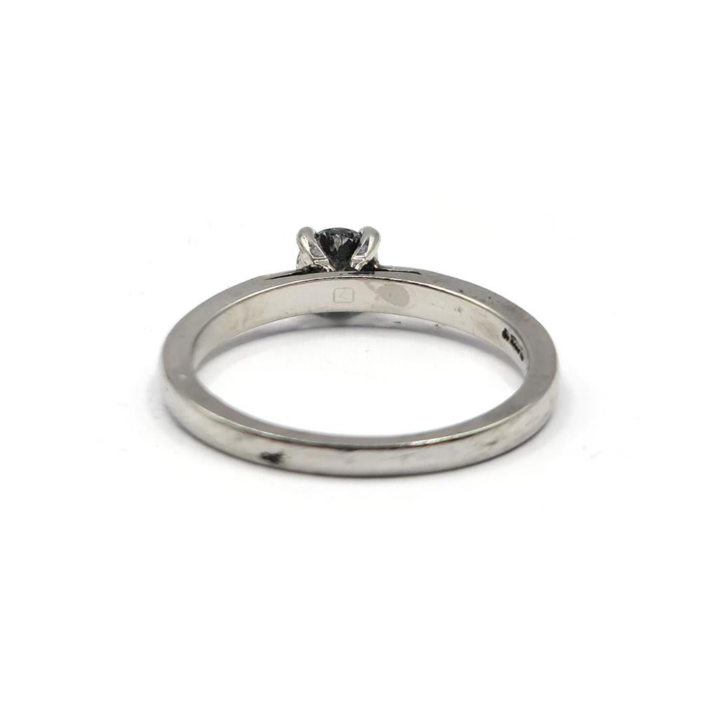 Platinum solitaire diamond ring with a 0.30 carat brilliant cut diamond, displayed on a plain background.