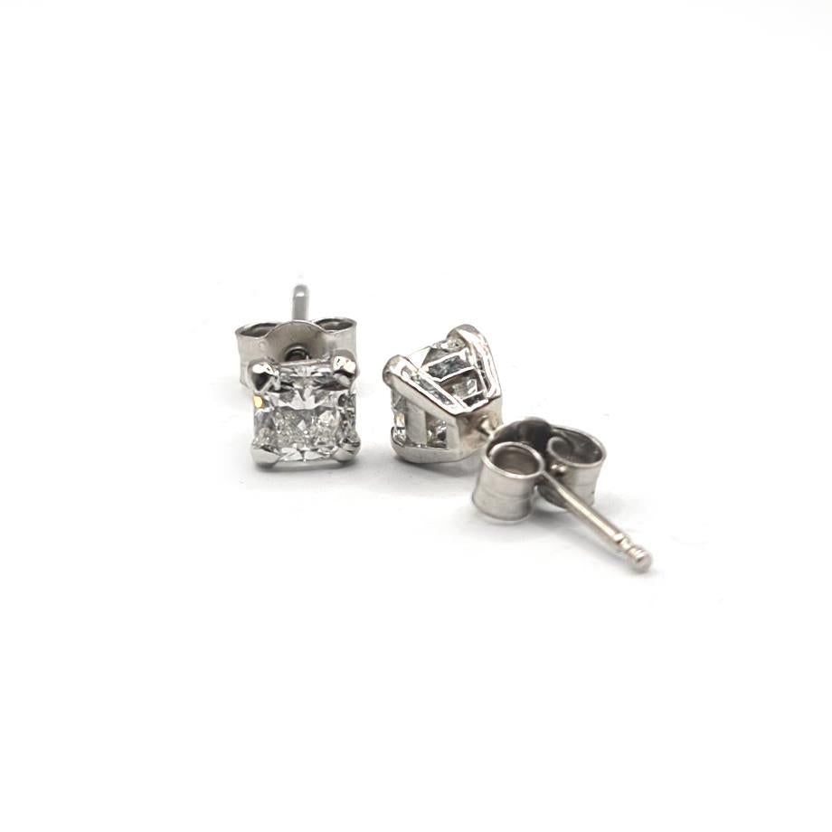 Platinum 1.00 carat GIA Certified diamond stud earrings with color G and clarity VS2, featuring round diamonds on classic studs.