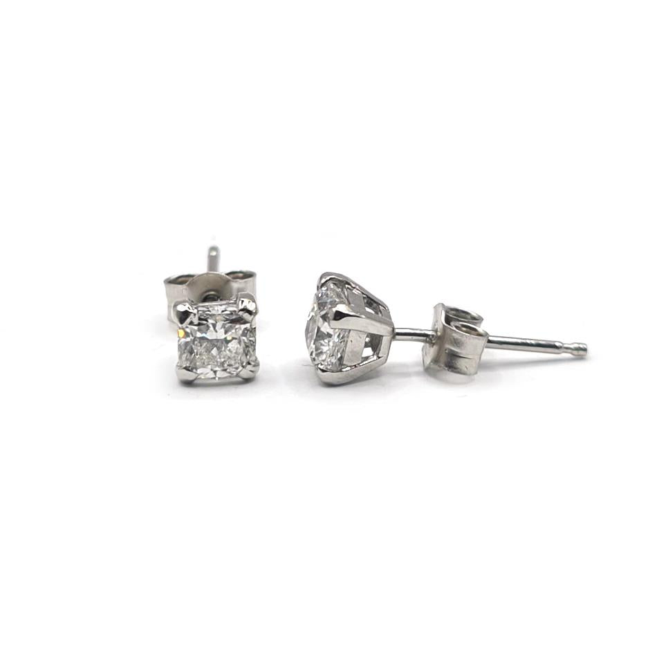 Platinum 1.00 carat GIA certified diamond stud earrings with color G and clarity VS2, featuring sparkling round diamonds.