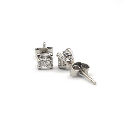 Platinum 1.00 carat GIA Certified diamond stud earrings with color G and clarity VS2, featuring classic four-prong settings.