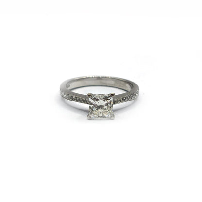 Platinum 1.00 carat princess cut diamond ring with a sleek band, showcasing a sparkling square diamond centerpiece.