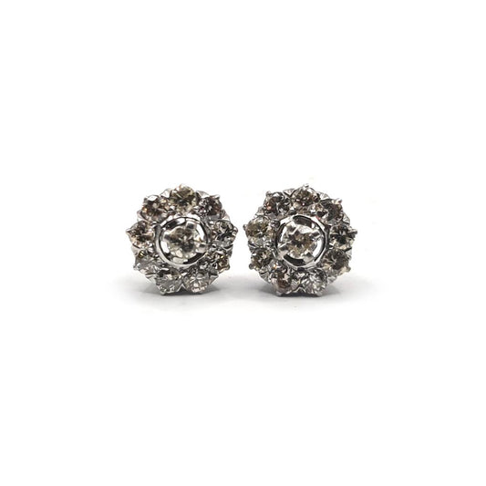 Platinum diamond stud earrings featuring 1.40 carat sparkling diamonds on classic platinum settings.