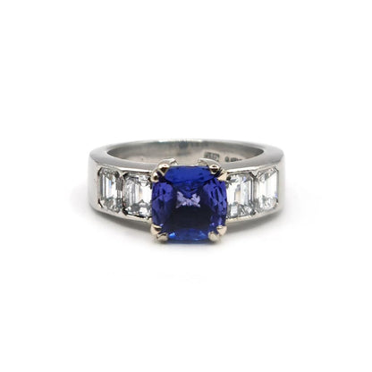 Platinum ring with a 1.79 carat tanzanite center stone surrounded by 1.60 carat diamonds, unbranded jewelry.