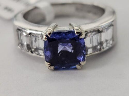 Platinum ring featuring a 1.79 carat tanzanite gemstone and 1.60 carat diamonds, showcasing a stunning gemstone ring design.