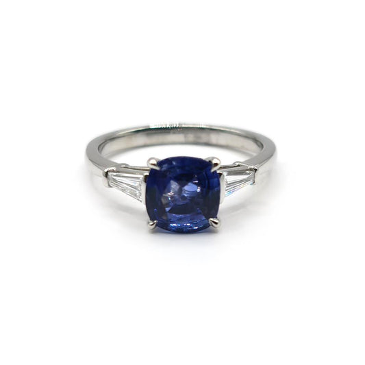 Unbranded platinum ring featuring a 1.85 carat sapphire center stone and 0.20 carat diamond accents.