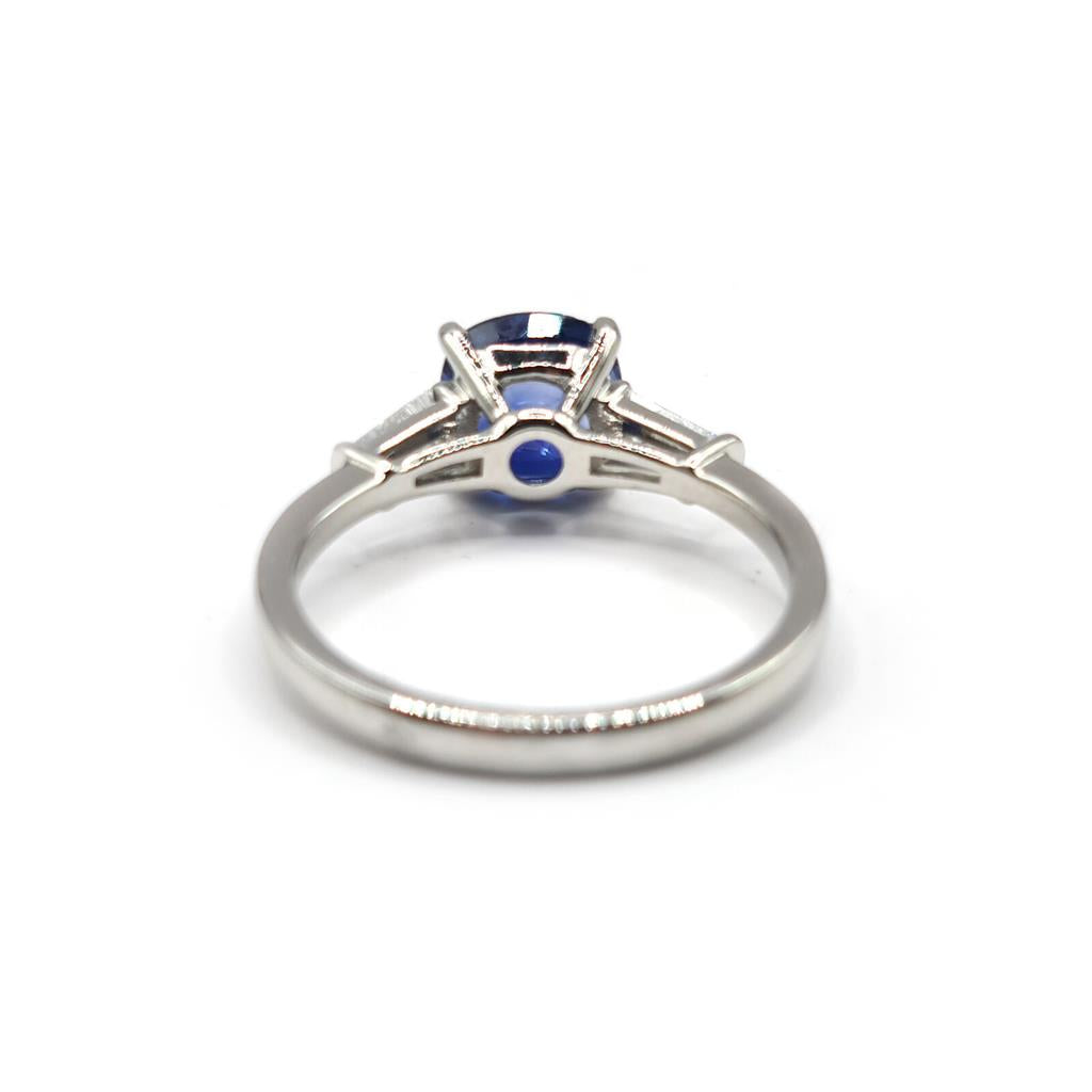 Platinum ring featuring a 1.85 carat sapphire centerpiece and 0.20 carat diamond accents, elegant and timeless jewelry design.